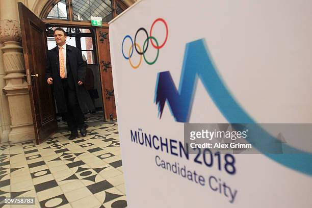 German Interior Minister Hans-Peter Friedrich arrives for a press conference at the Munich 2018 media center on March 4, 2011 in Munich, Germany. The...
