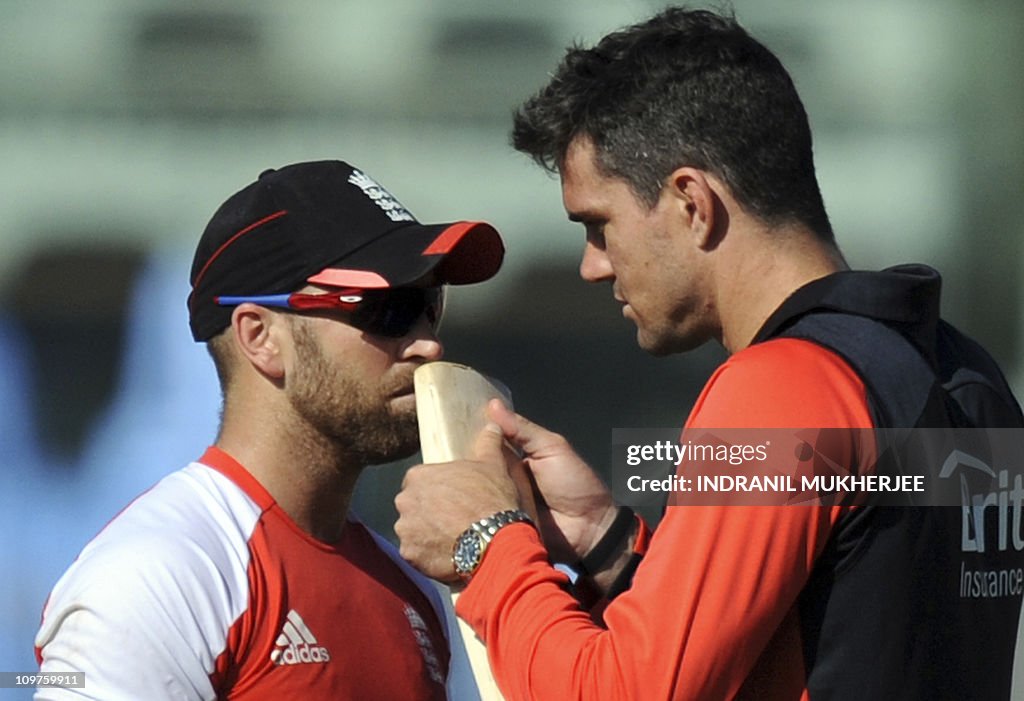 England cricketer Matt Prior (L) sniffs