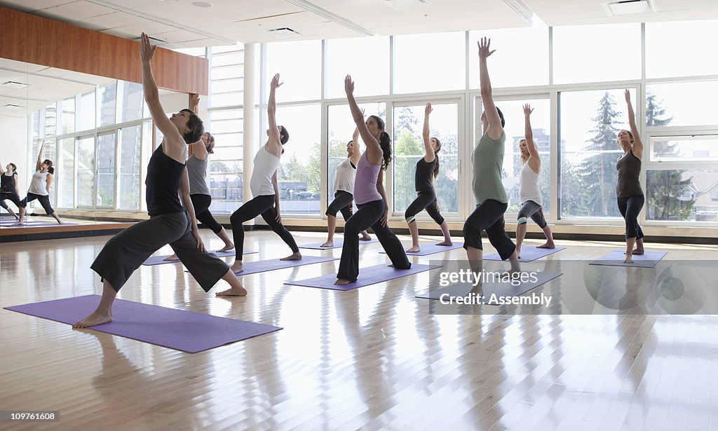 Yoga class being led by instructor