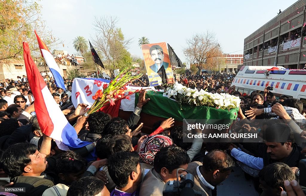 Pakistani Christians march carrying the