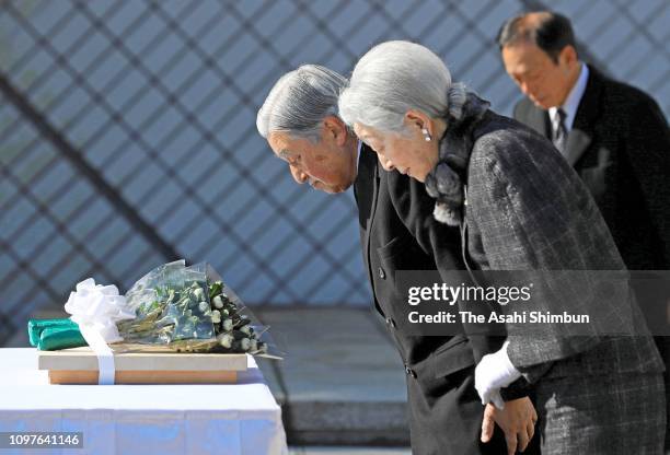 Emperor Akihito and Empress Michiko bow at a cenotaph for the died sailors of commercial and fishery vessels during the WWII at Kannonzaki Park on...