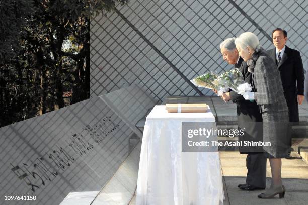 Emperor Akihito and Empress Michiko bow at a cenotaph for the died sailors of commercial and fishery vessels during the WWII at Kannonzaki Park on...