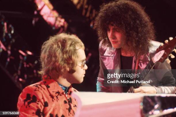 Singer and guitarist Marc Bolan of T-Rex performing with Elton John on the BBC television show Top of the Pops on December 20, 1971.