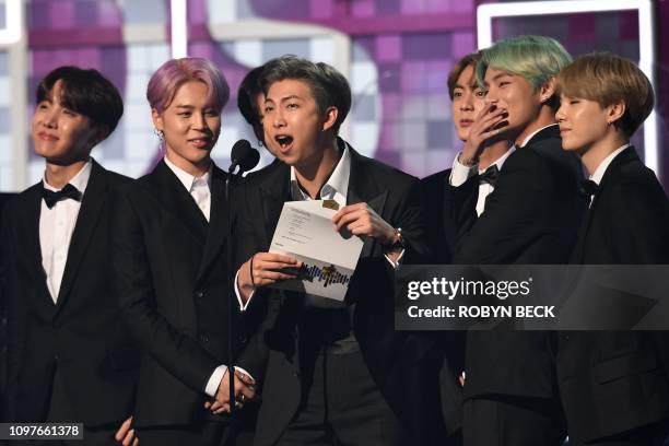 South Korean band BTS presents the award for Best R&B Album during the 61st Annual Grammy Awards on February 10 in Los Angeles.