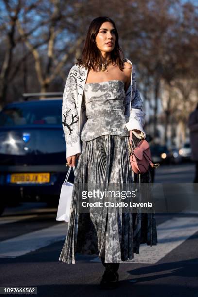 Patricia Manfield, wearing a Dior printed top with matching maxi skirt, black boots, white bag and printed big scarf, is seen outside Christian Dior...