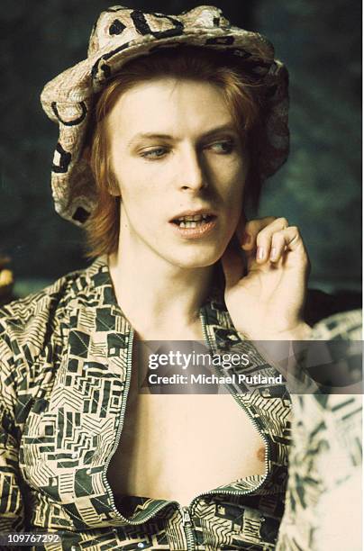 Singer David Bowie being interviewed at his ground floor flat at Haddon Hall, where he has been redecorating the ceiling in silver paint, Beckenham,...