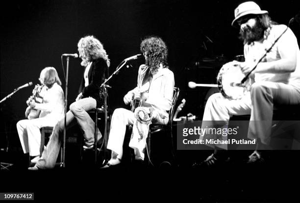 Bassist John Paul Jones, singer Robert Plant, guitarist Jimmy Page and drummer John Bonham of British rock band Led Zeppelin performing on stage at...