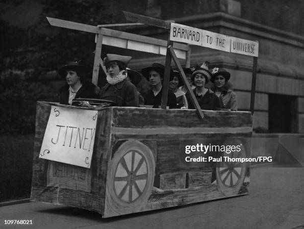 Group of women in a wooden jitney during a graduation parade at Barnard College, New York in 1910.