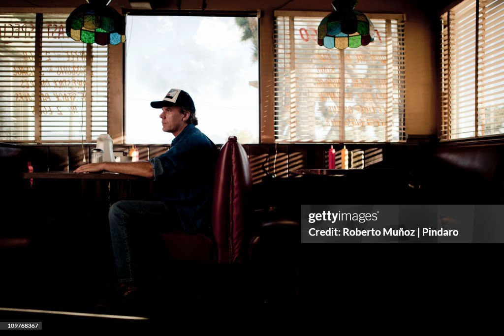 Trucker waiting for service in a diner