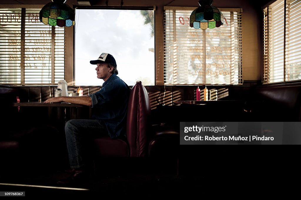 Trucker waiting for service in a diner