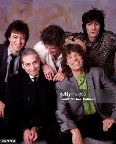 Posed group portrait of the Rolling Stones in London, England in 1986. Left to right are bassist Bill Wyman, drummer Charlie Watts, guitarist Keith...