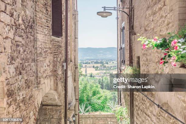 looking out from spello - stone wall garden stock pictures, royalty-free photos & images
