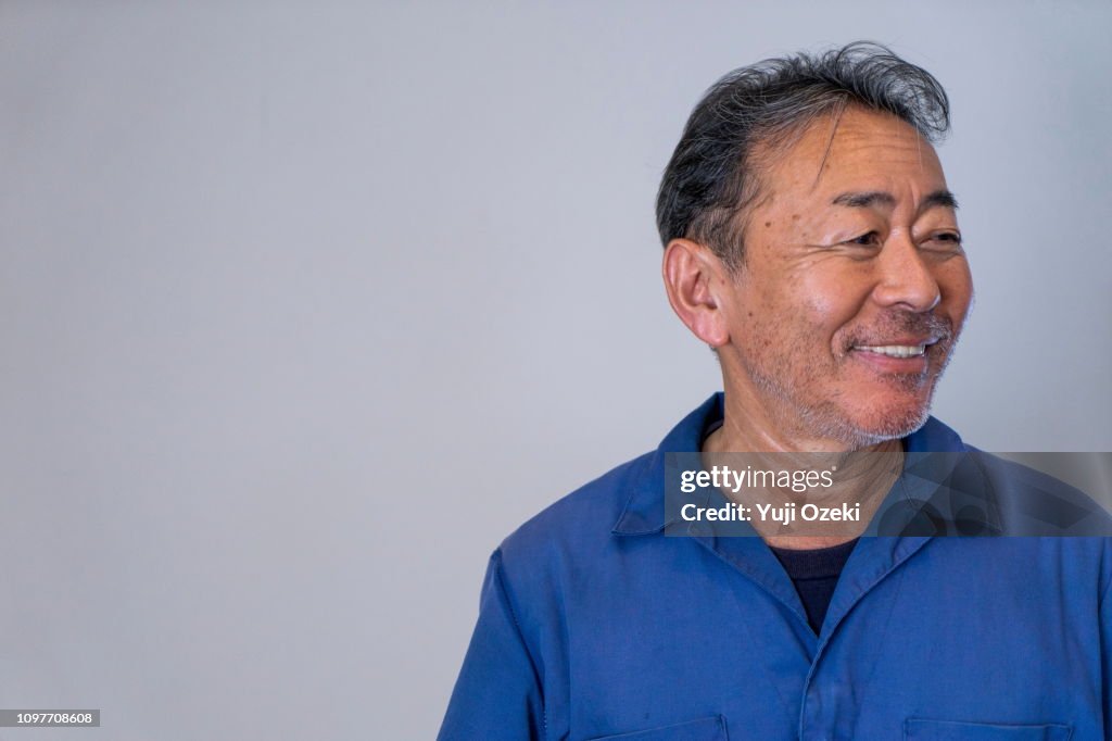 A man with a blue working clothes