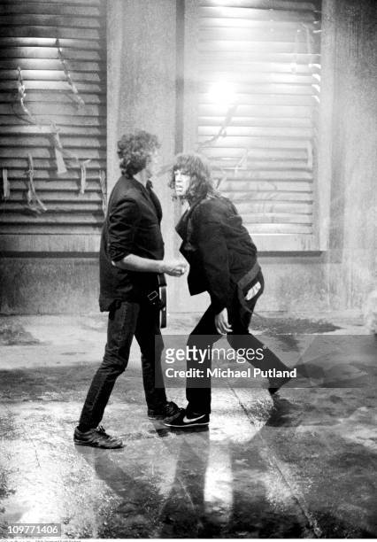 Guitarist Keith Richards and singer Mick Jagger of the Rolling Stones on the set of the music video for 'One Hit ' in England in May 1986.