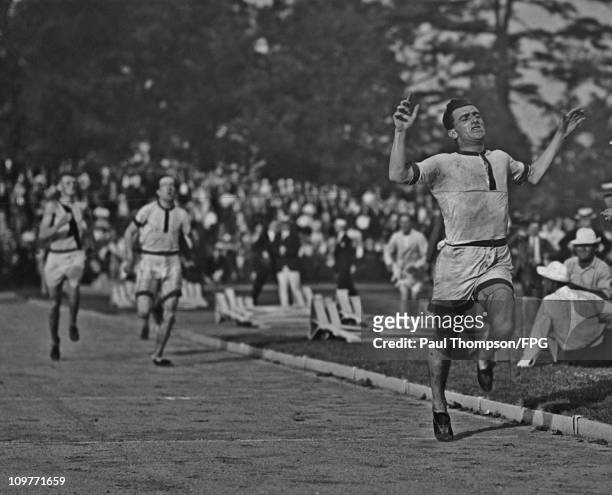 South African athlete Bevil Rudd winning an 800 metre race circa 1920.