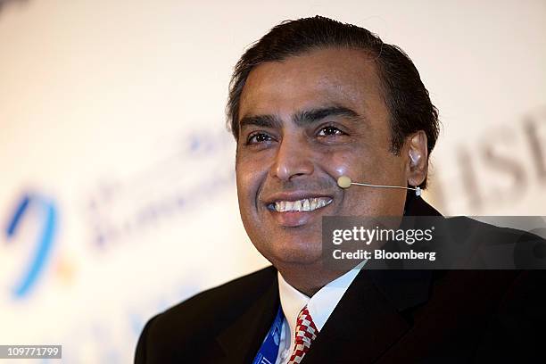 Mukesh D. Ambani, chairman of Reliance Industries Ltd., smiles at the Institute of International Finance Spring Membership Meeting in New Delhi,...