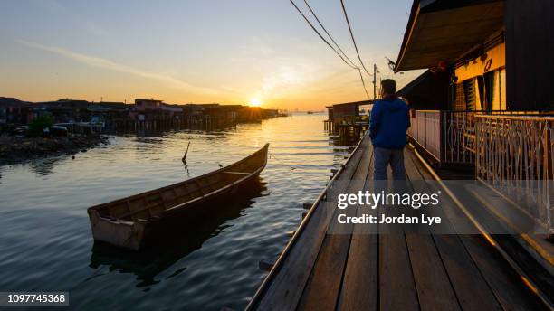 sunrise in wooden jetty - george town penang stock pictures, royalty-free photos & images