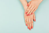 Woman hands on blue background
