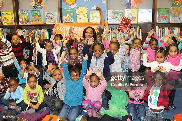 Actress Vivica A. Fox celebrates "Read Across America" by reading "The Story of Ferdinand the Bull" and distributing books at the Brooklyn Public...