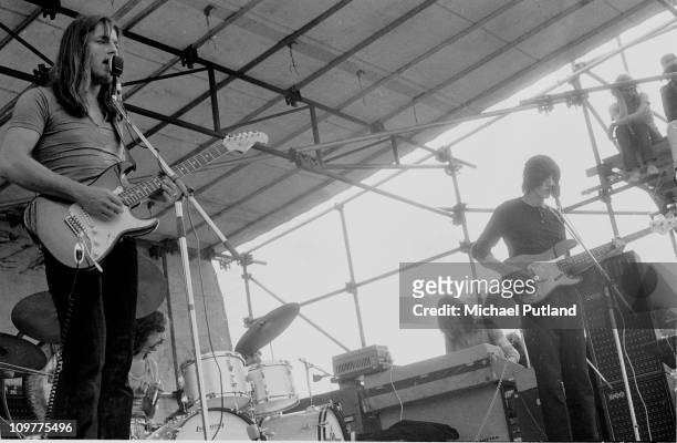 Singer and guitarist David Gilmour, drummer Nick Mason, keyboard player Rick Wright and bassist Roger Waters of Pink Floyd performing on stage in...