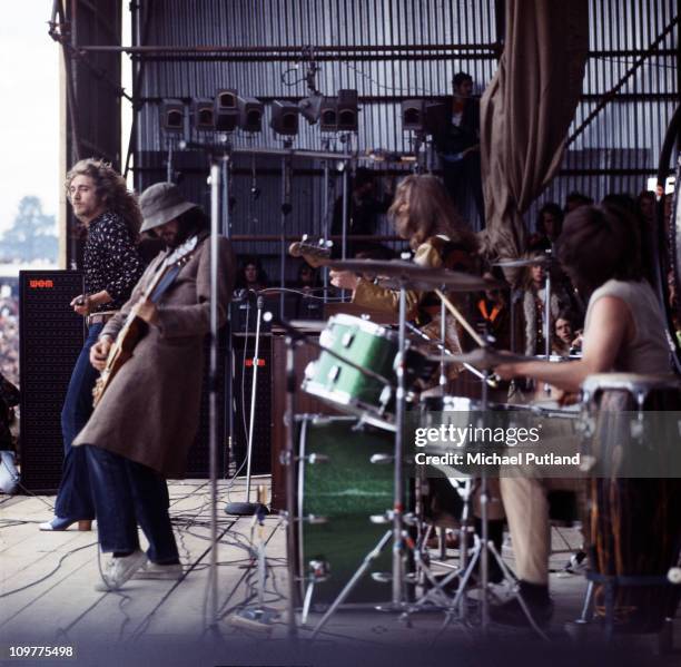 Singer Robert Plant, guitarist Jimmy Page, bassist John Paul Jones and drummer John Bonham of British rock band Led Zeppelin performing on stage at...