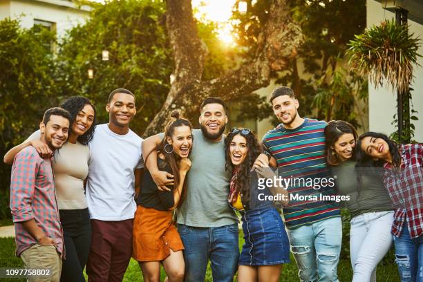 portrait of multi-ethnic happy friends in party - person gemischter abstammung stock-fotos und bilder