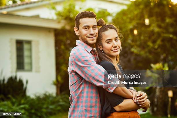 Portrait of affectionate couple in back yard