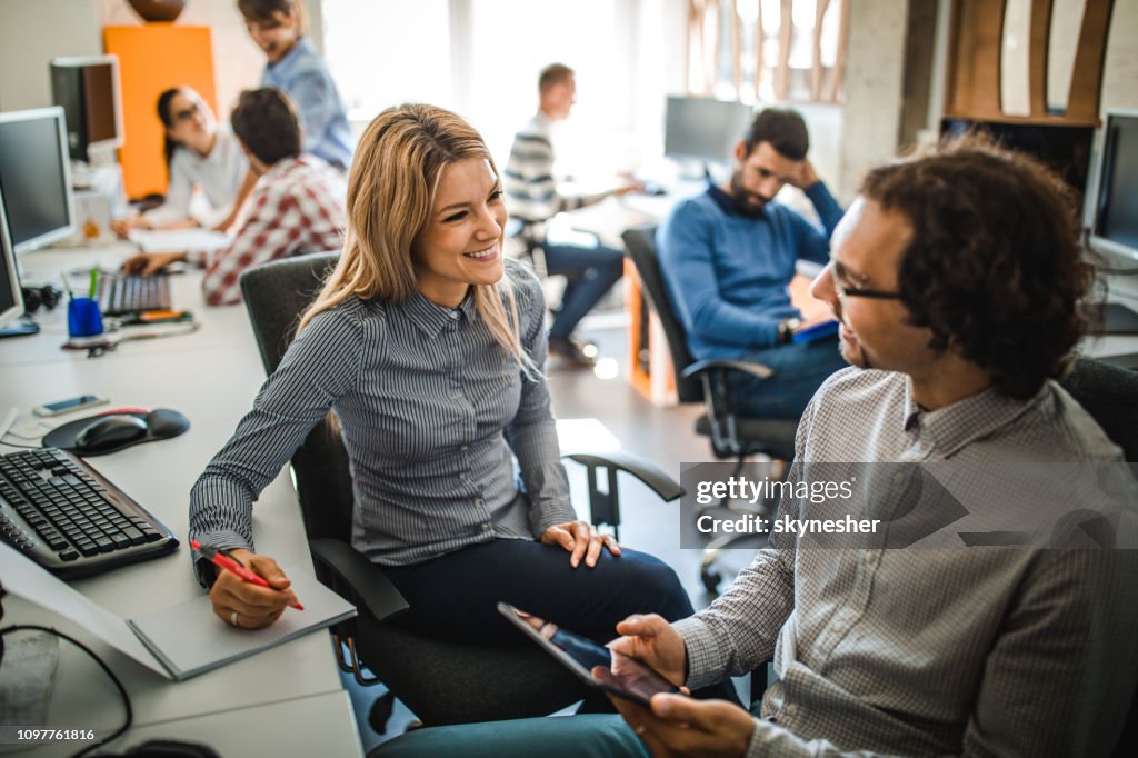 Happy Computer Programmers Talking While Cooperating In The Office High ...