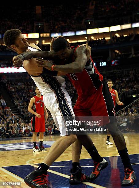 Tempers flare as Brook Lopez of the Nets and Amir Johnson of the Raptors clash during the NBA match between New Jersey Nets and the Toronto Raptors...