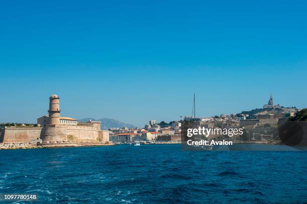 View from a boat of Fort St. Jean and the entrance to the Vieux Port in Marseille, France.