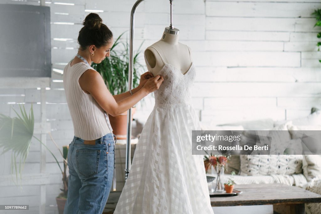 Fashion designer creating gowns