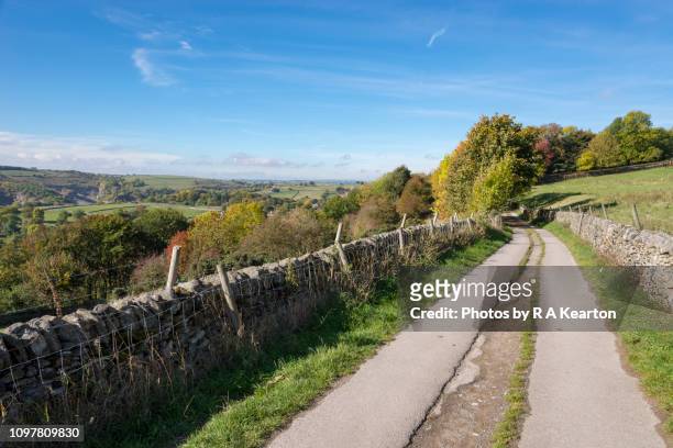 country road near eyam, peak district, derbyshire, england - eyam derbyshire stock pictures, royalty-free photos & images