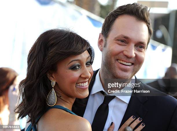 Actress Tamera Mowry and reporter Adam Housley arrive at the 42nd NAACP Image Awards held at The Shrine Auditorium on March 4, 2011 in Los Angeles,...
