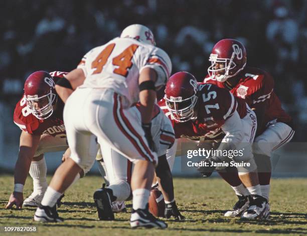 Eric Moore, Quarterback for the University of Oklahoma Sooners calls the play at the line of scrimmage during the NCAA Big 8 Conference college...