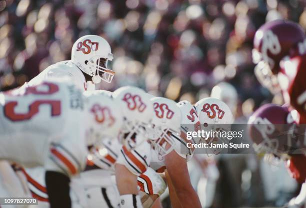 Tone Jones, Quarterback for the Oklahoma State Cowboys calls the play at the line of scrimmage during the NCAA Big 8 Conference college football game...