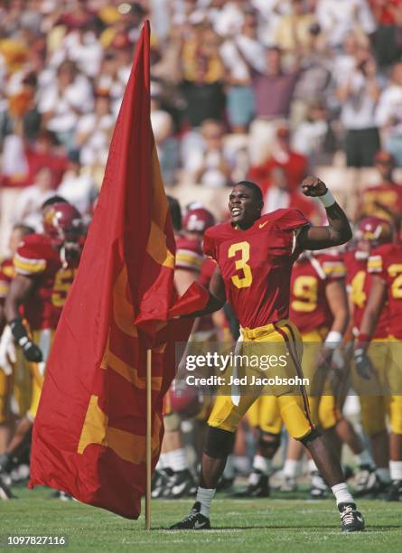 Keyshawn Johnson, Wide Receiver for the University of Southern California USC Trojans parades the USC Trojan flag during the NCAA Pac-10 Conference...