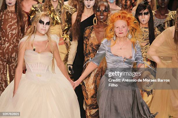 AVivienne Westwood and a model walk the runway during the Vivienne Westwood Ready to Wear Autumn/Winter 2011/2012 show during Paris Fashion Week at...
