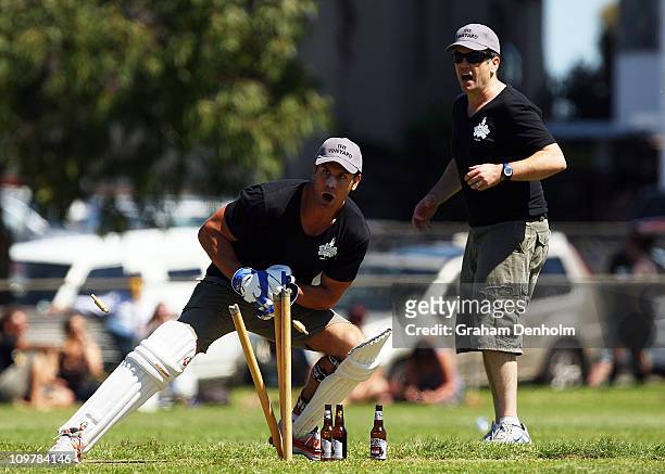 Former AFL player Wayne Carey of team The Vineyard stumps his opponent during the 'Batting for the Battlers' Celebrity Charity Cricket Match at...