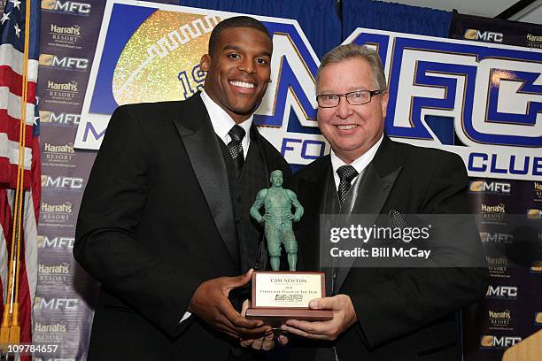 Cam Newton, Auburn University's QB and winner of the 74th Annual Maxwell Award for College Player of the Year accepts his Award from Ron Jaworski at...