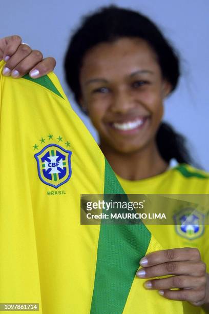 Model demonstrates the new official jersey of the Brazilian soccer team, with five stars , in Sao Paulo, Brazil, 08 July 2002. AFP PHOTO/Mauricio...