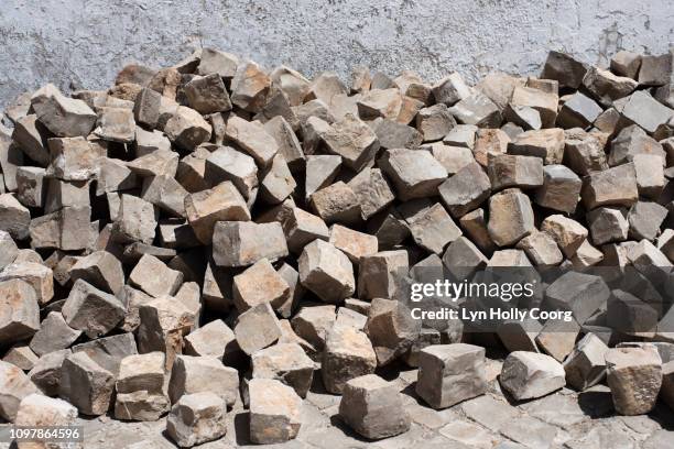 pile of portuguese granite stones - lyn holly coorg stockfoto's en -beelden