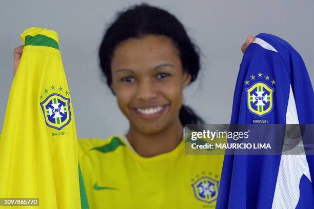 Model demonstrates the new official jersey of the Brazilian soccer team, with five stars , in Sao Paulo, Brazil, 08 July 2002. AFP PHOTO/Mauricio...