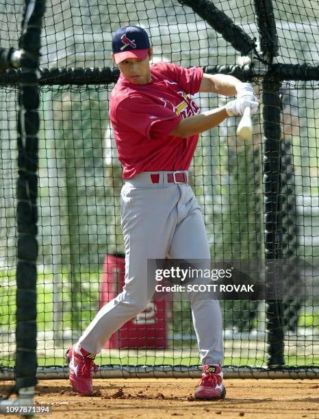 St. Louis Cardinals' Japanese newcomer So Taguchi takes his first swing of the day during his first workout of Spring Training in Jupiter, FL, 18...