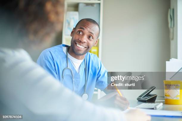 happy gp consultation - triage stock pictures, royalty-free photos & images