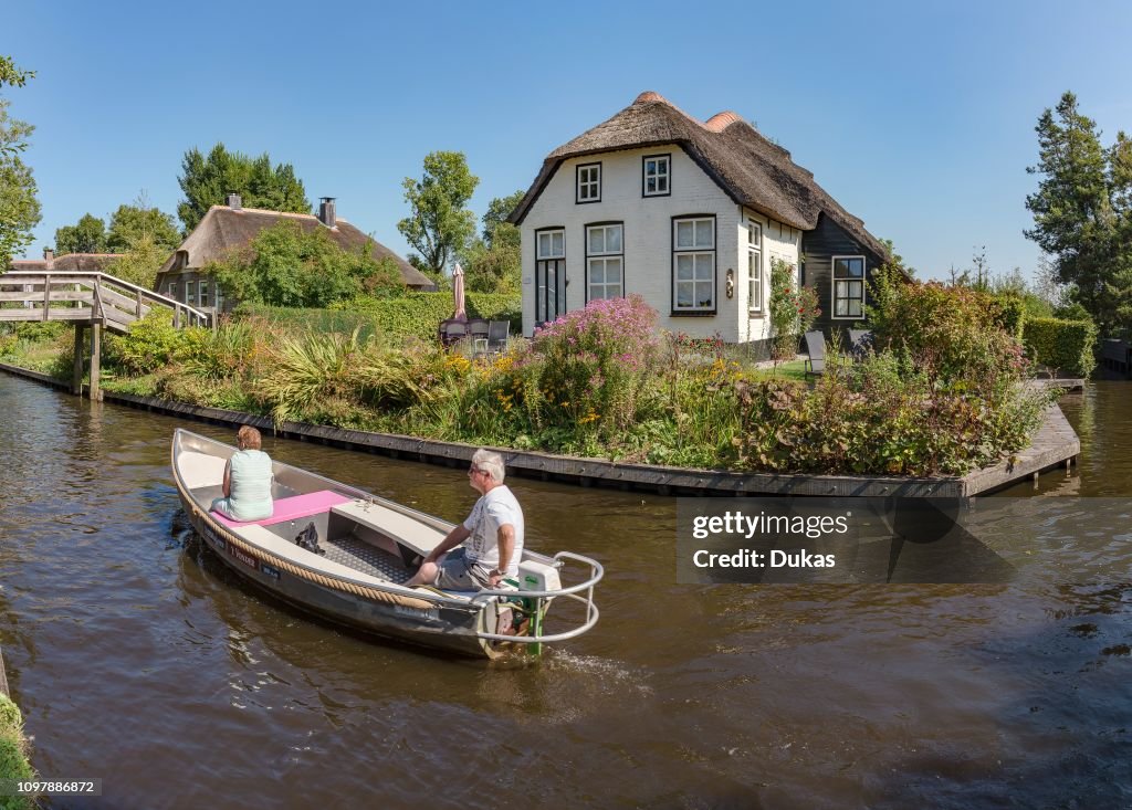 Thathed roof houses along a canal, Giethoorn,  Overijssel