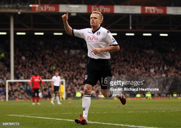 Damien Duff of Fulham celebrates scoring the first goal during the Barclays Premier League match between Fulham and Blackburn Rovers at Craven...