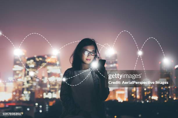 social connecting concept at night - wireless technology foto e immagini stock