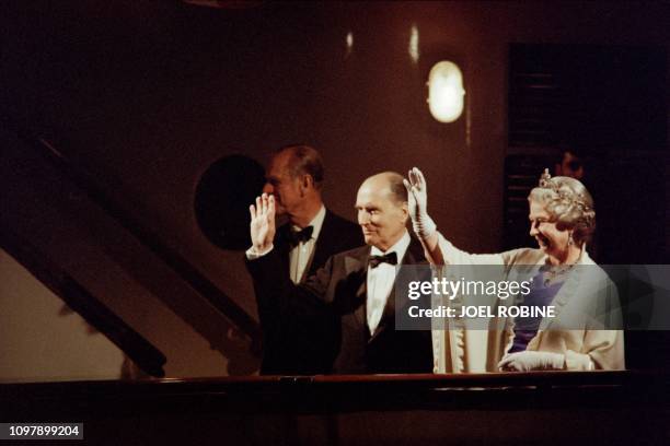 Britain's Queen Elizabeth II and her husband Prince Philip, Duke of Edinburgh receive French President François Mitterrand on their Royal yacht...