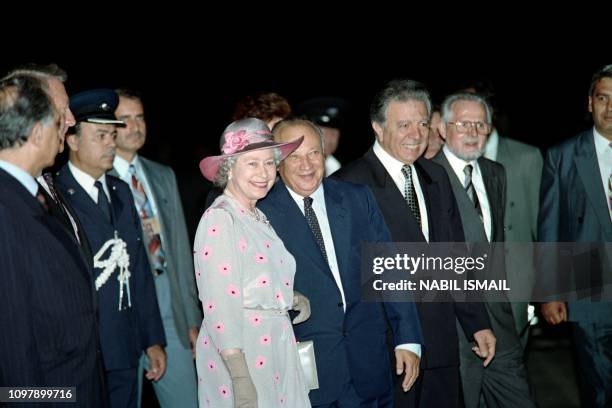 Britain's Queen Elizabeth II is welcomed by Cyprus' President Glafcos Clerides upon her arrival at Larnaca airport on October 18, 1993. The Queen...