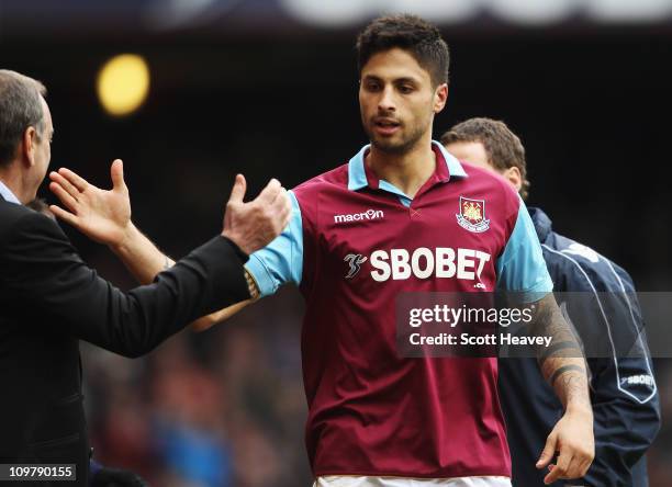 Manuel da Costa of West Ham United celebrates with his manager Avram Grant after scoring during the Barclays Premier League match between West Ham...